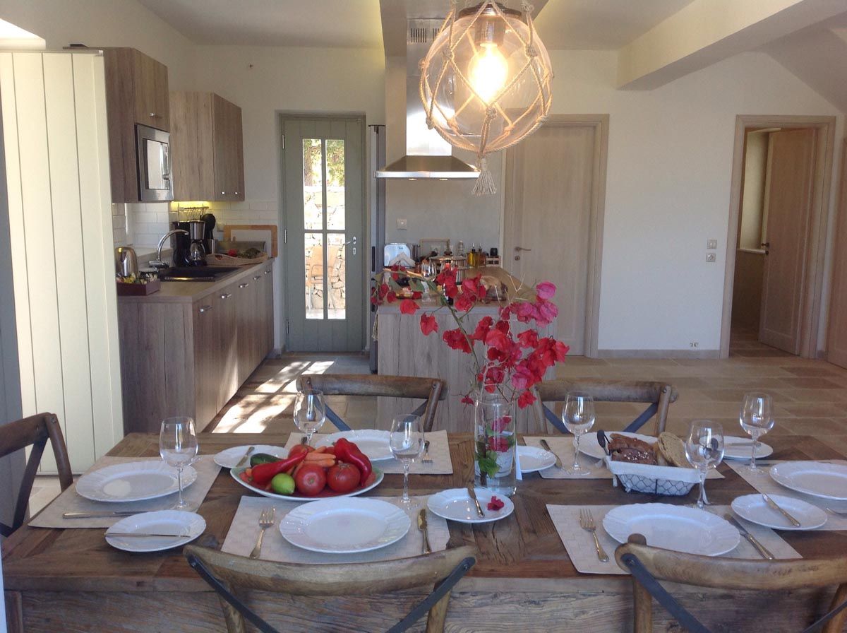 Table laid for dinner at Perla House with fresh flowers