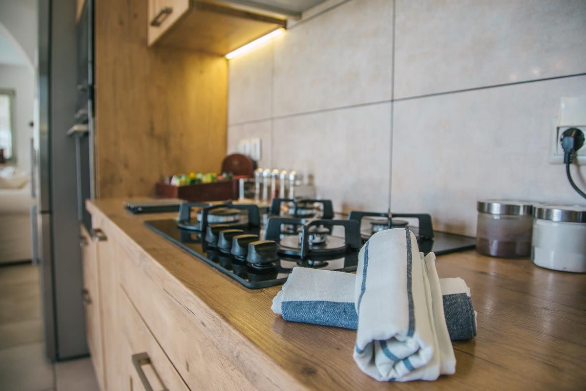 Kitchen at Mistral House with a timber worktop and gas hob