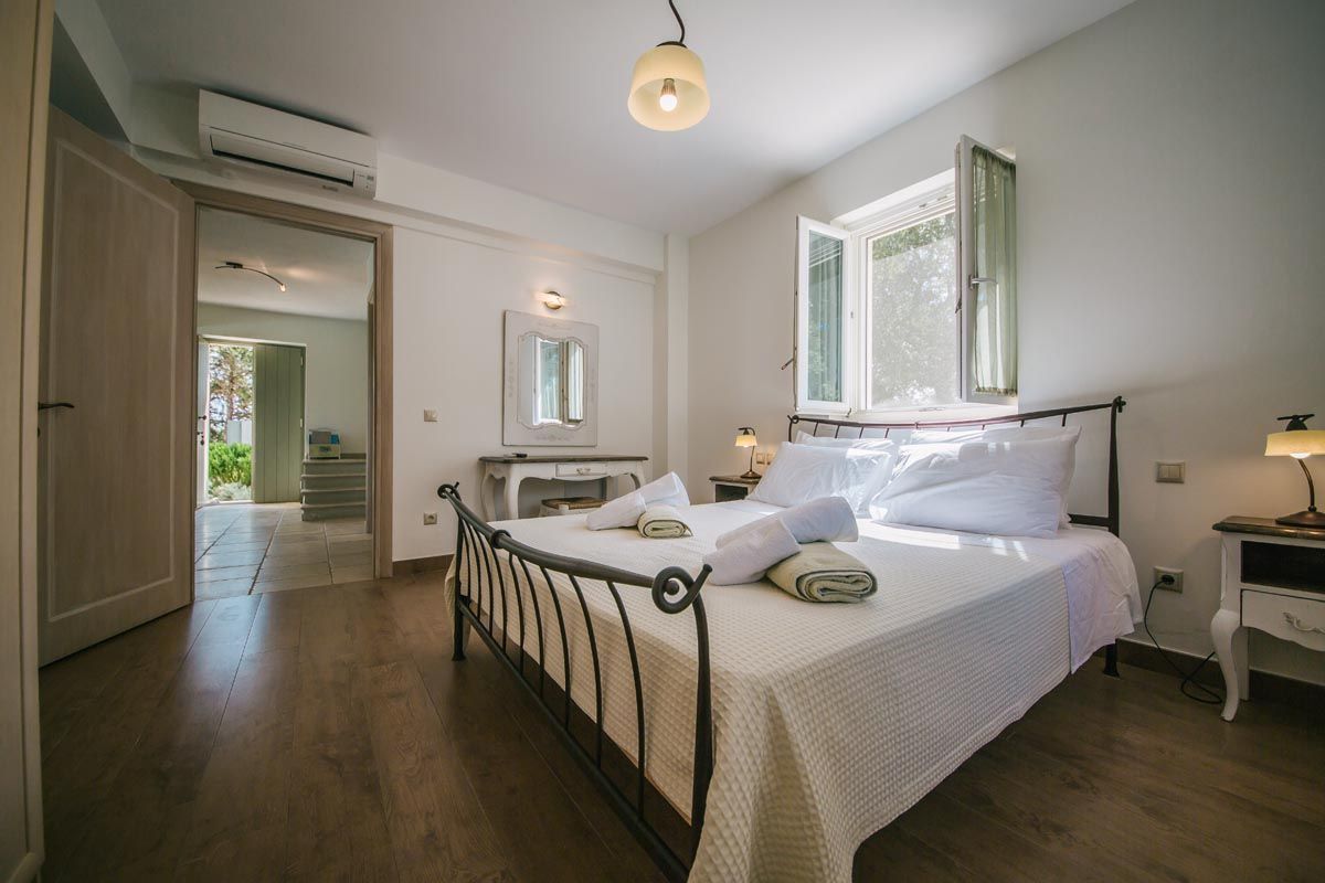 Bedroom at Mistral House with fitted wardrobes and garden light