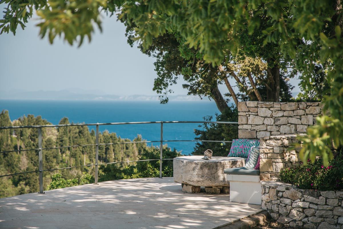 Stone seating terrace at Mistral House with a wide view over the Ionian Sea
