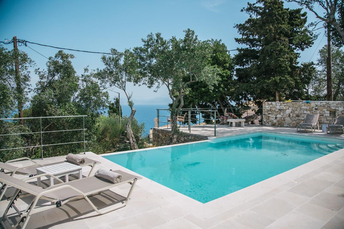 Wide view of the Perla House pool and sunbathing terrace