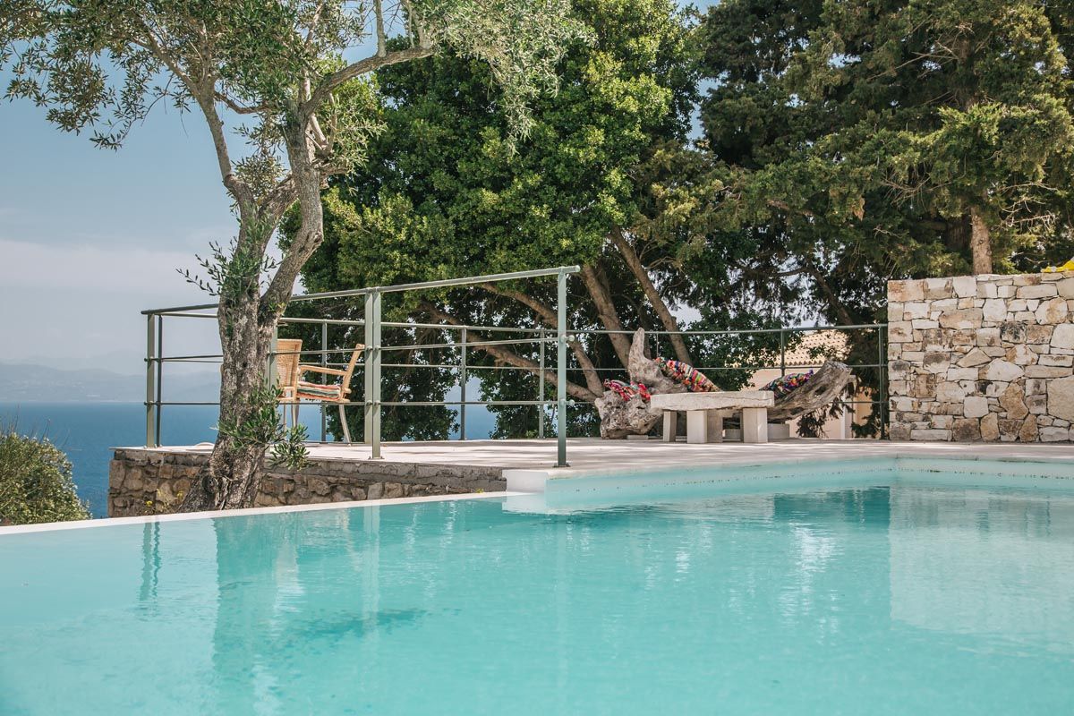 Steps leading into the pool at Perla House among the olive trees