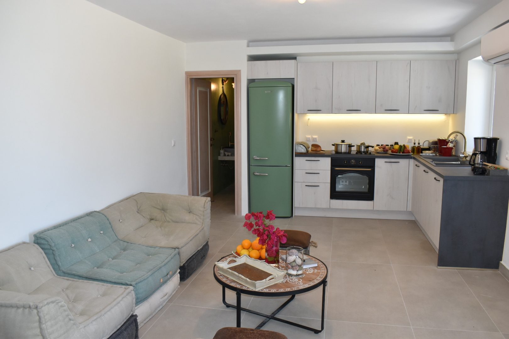 Open-plan studio at Perla House with its sitting area and kitchen