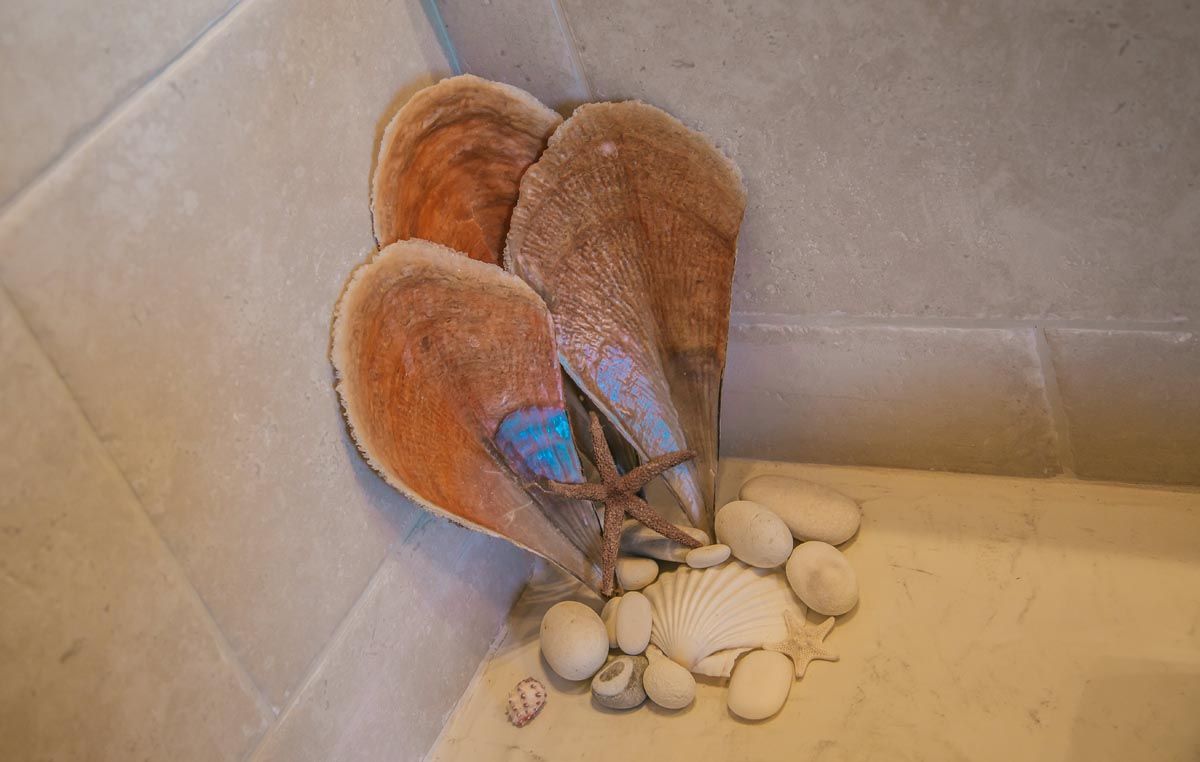 Bathroom detail at Mistral House with shells and stone basin